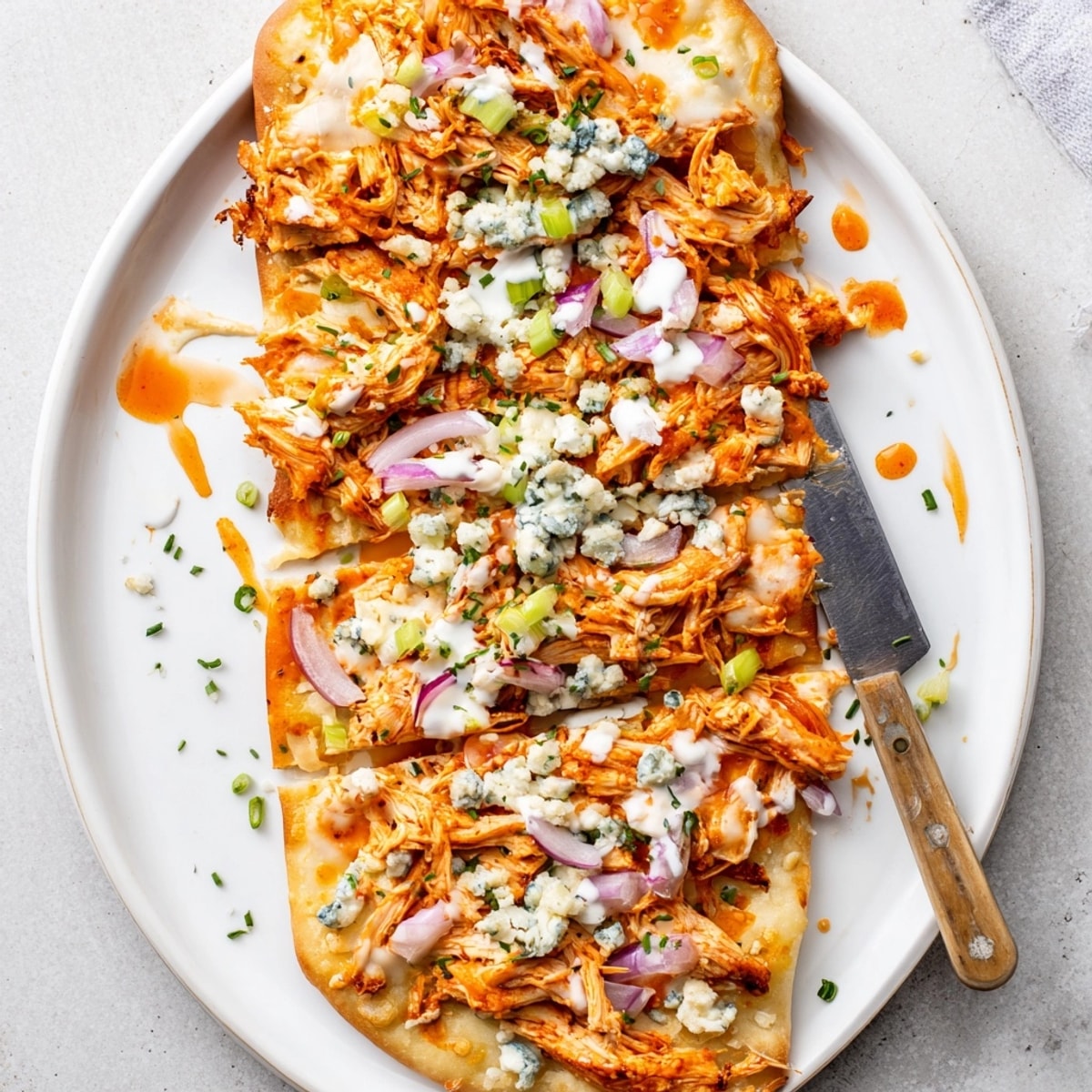 Crisp Buffalo Chicken &amp; Blue Cheese Flatbread: creamy, spicy, and cheesy—perfect family dinner for sharing.