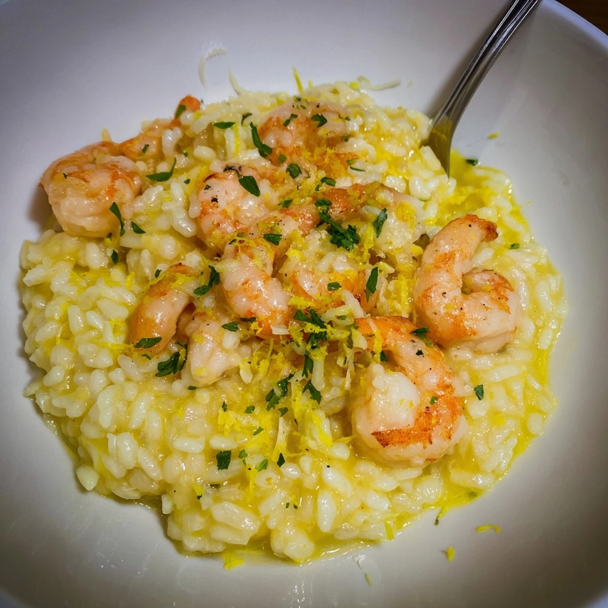 Golden Saffron and Lemon Risotto with tender shrimp, a comforting, aromatic dish.