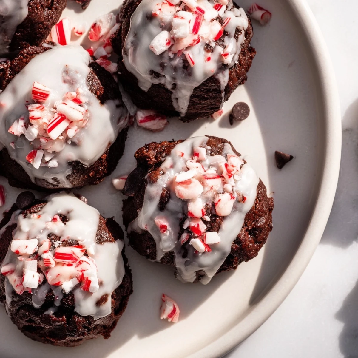 Warm Peppermint Brownie Bites fresh from the oven, showing a delicious minty chocolate swirl and toppings.