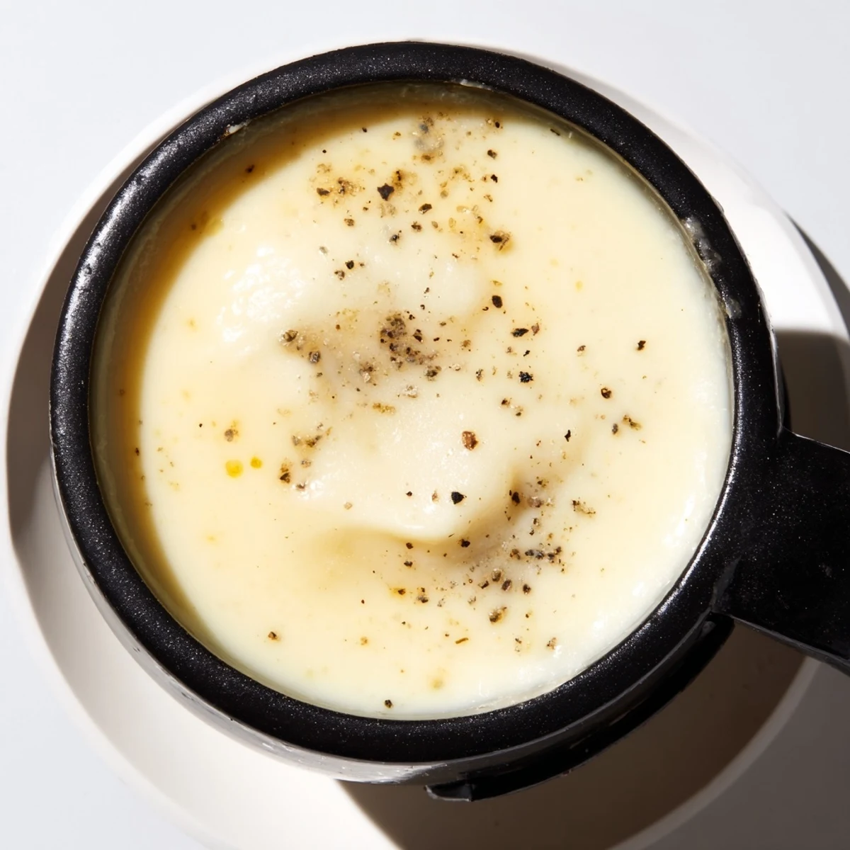Rustic cheese fondue in a fondue pot, perfect for a cozy gathering, rich and flavorful.