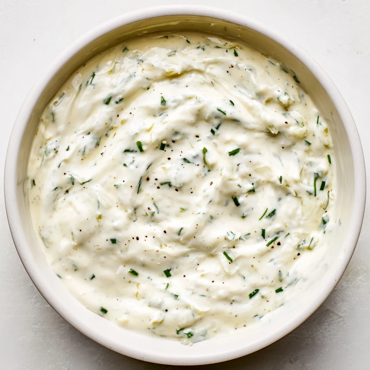 Freshly made creamy garlic dip, perfect for crudités and adding a tangy flavor.
