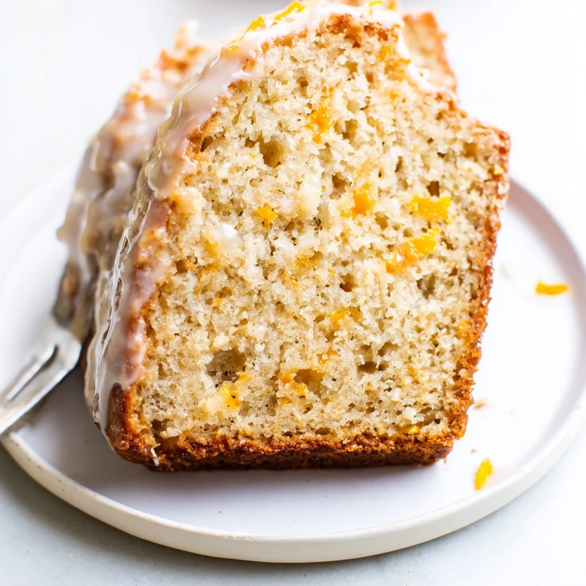 The golden-brown crust of this Orange Bread promises a burst of vibrant orange flavor inside.