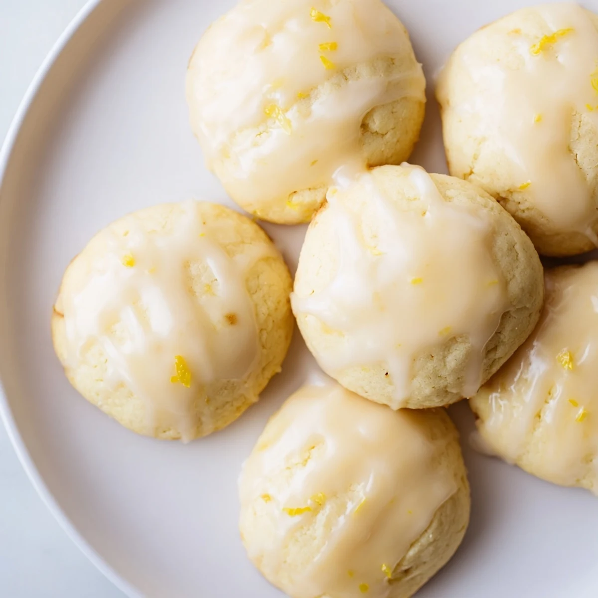 Fluffy Lemon Ricotta Cookies with a vibrant lemon glaze, perfect for a sunny dessert!
