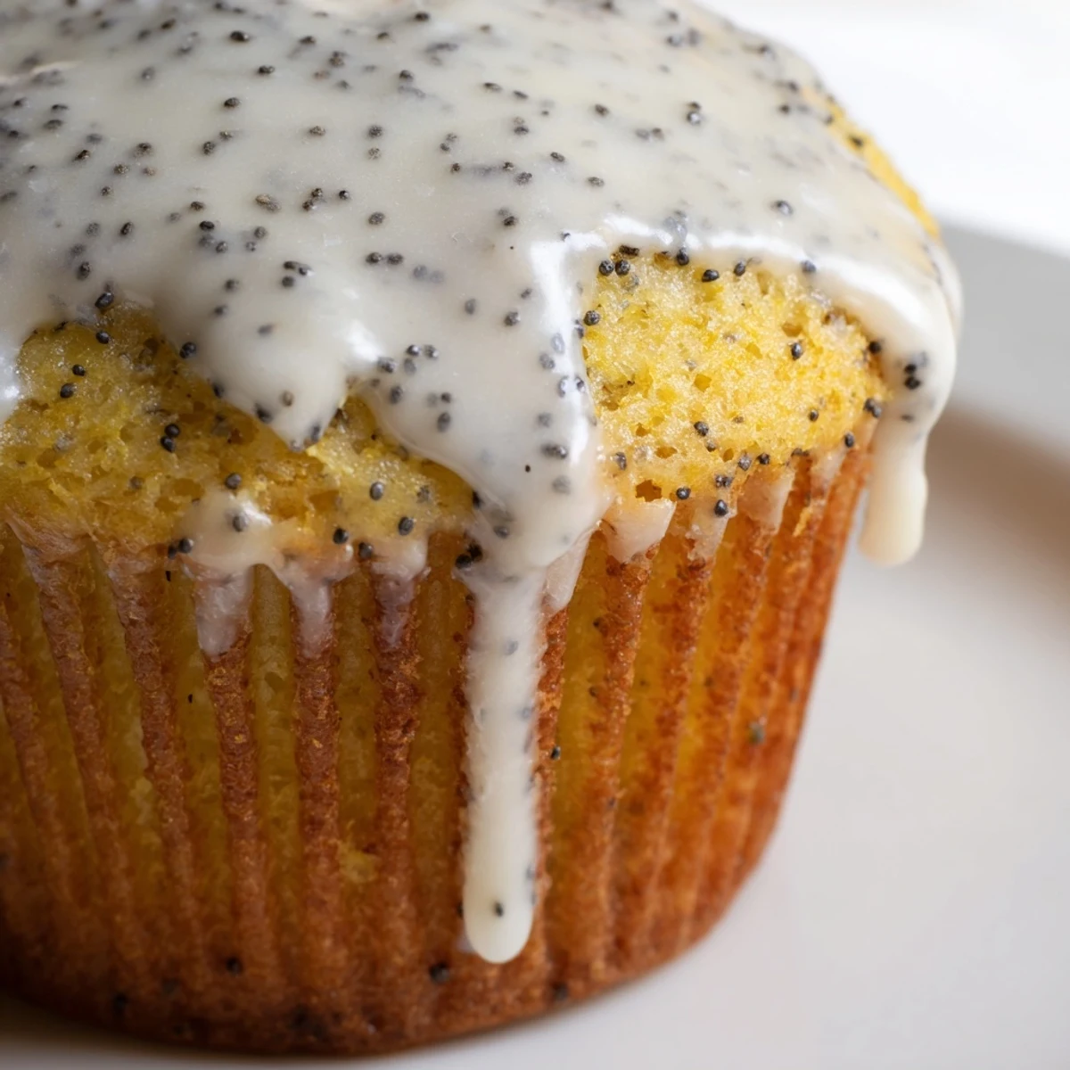 Freshly baked Lemon Poppy Seed Muffins are arranged on a platter, ready to be served for breakfast or an afternoon snack with coffee.