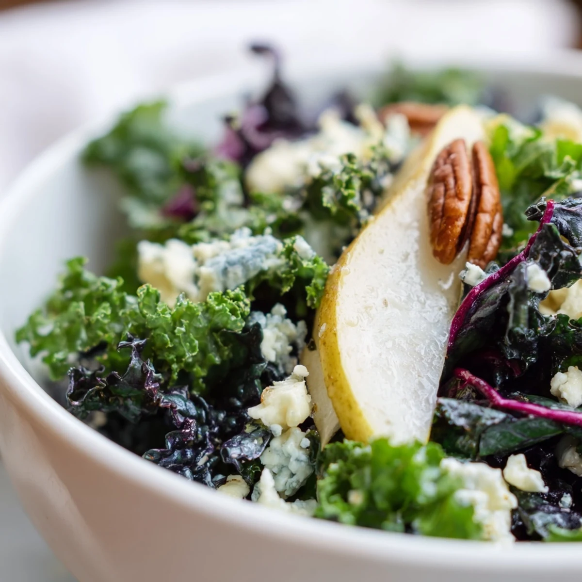 Freshly sliced pears and toasted walnuts top a vibrant Winter Green Salad with tangy vinaigrette.