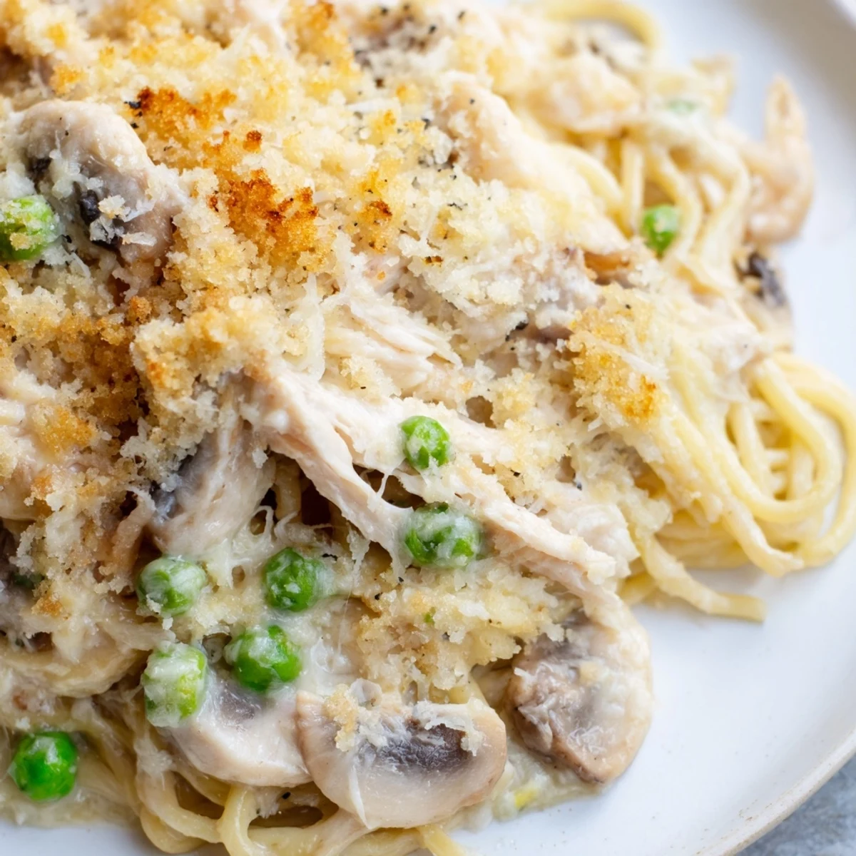 Creamy Turkey Tetrazzini pasta loaded with tender turkey, sautéed mushrooms, and melted cheese.