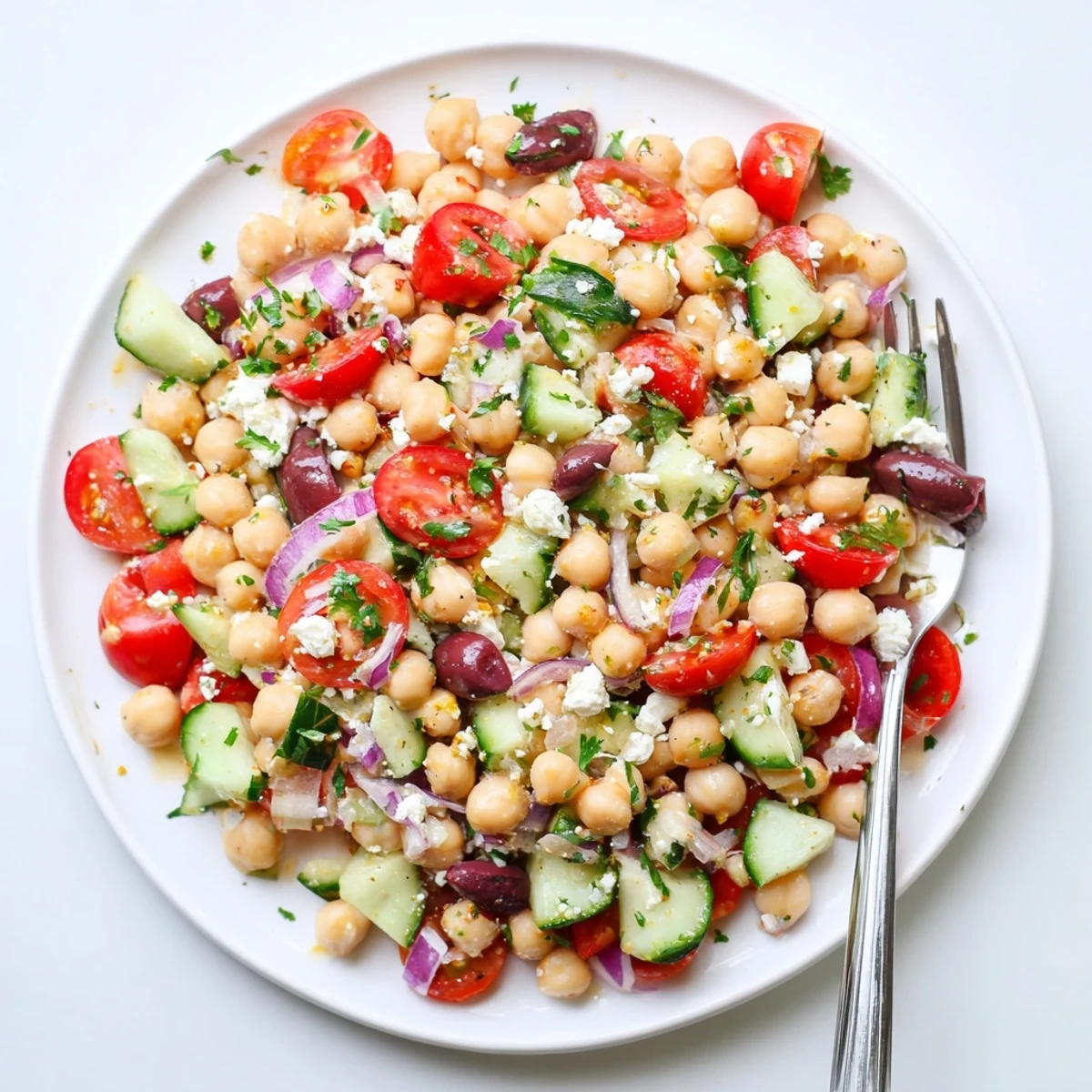 Bright Mediterranean Chickpea Salad tossed with Kalamata olives and bell peppers, served as a light vegetarian lunch or side.