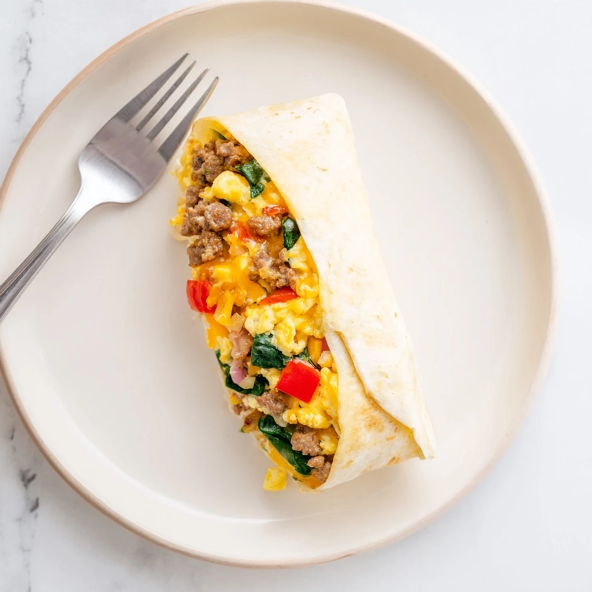 Make-Ahead Breakfast Burritos wrapped in foil, ready for a quick and savory morning meal.