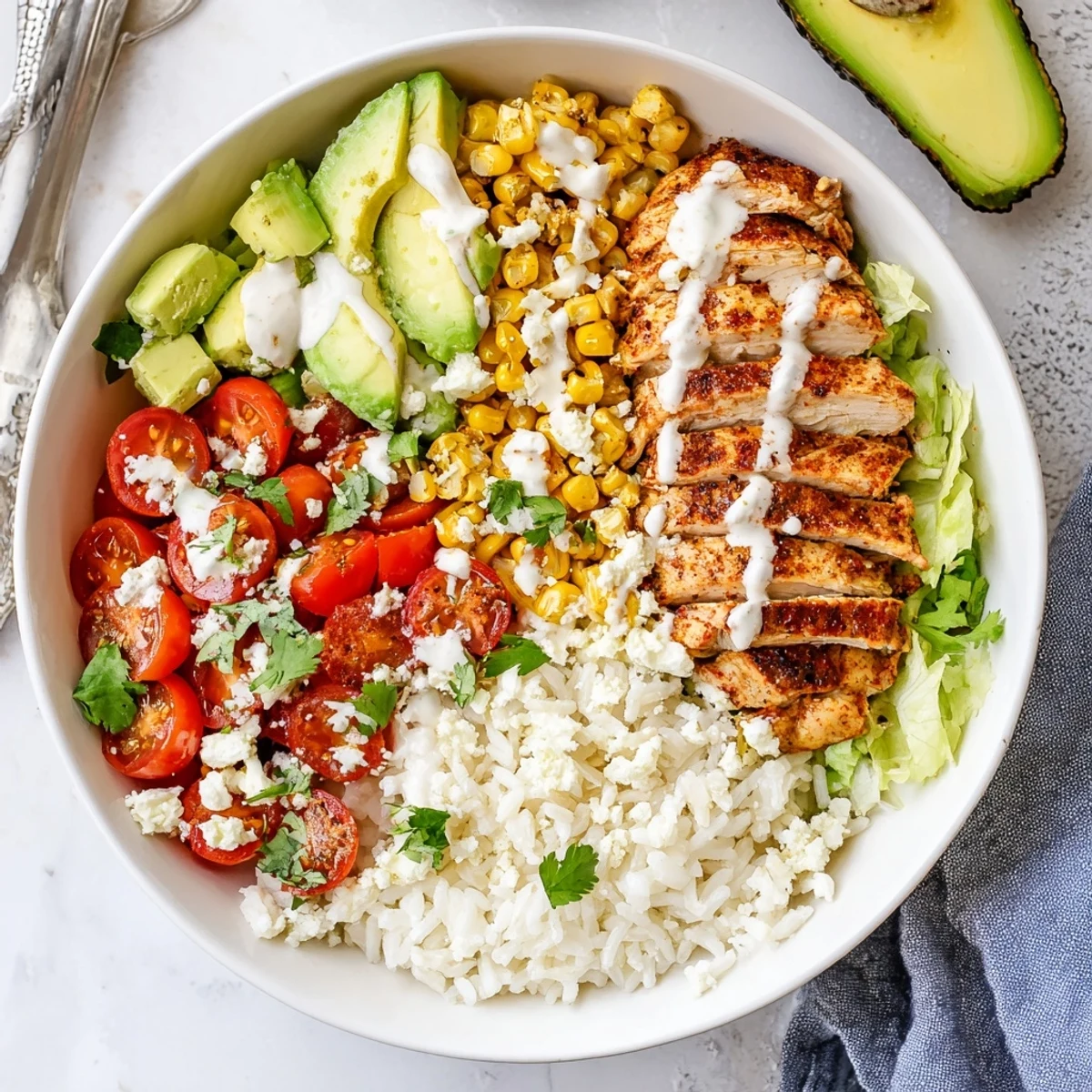 Juicy spiced chicken served over rice with charred street corn cherry tomatoes and crumbled salty cheese topping