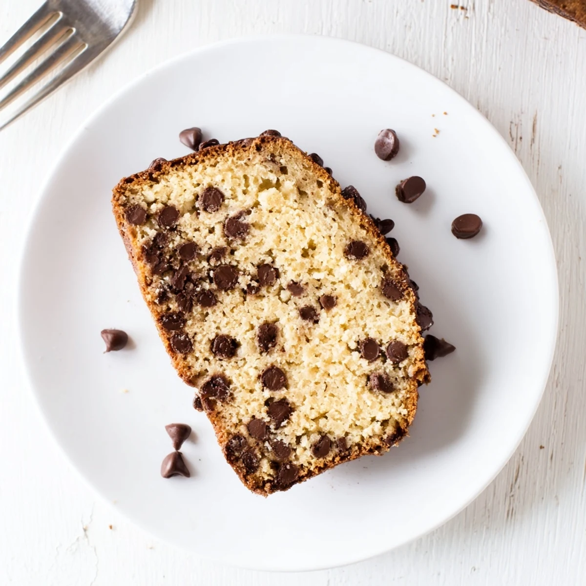Freshly baked chocolate chip banana bread cooling on a wire rack