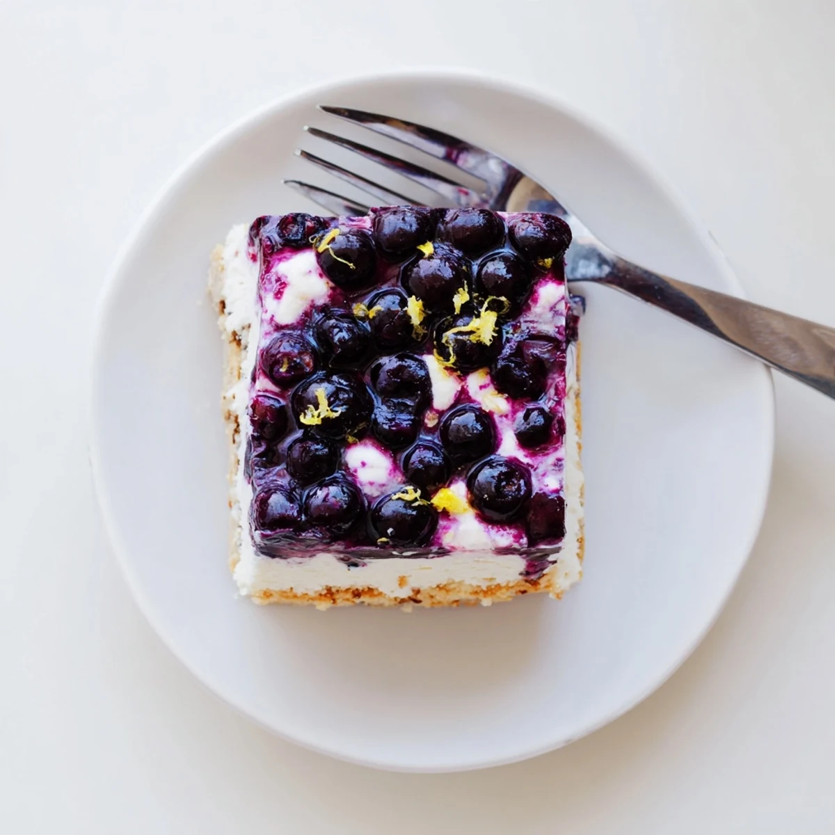 Sweet and tangy blueberry jambaree bar with buttery pecan base, chilled and ready to serve