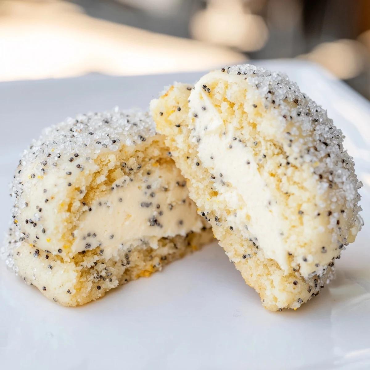 Soft golden lemon poppy seed cheesecake cookies with creamy centers and white speckles