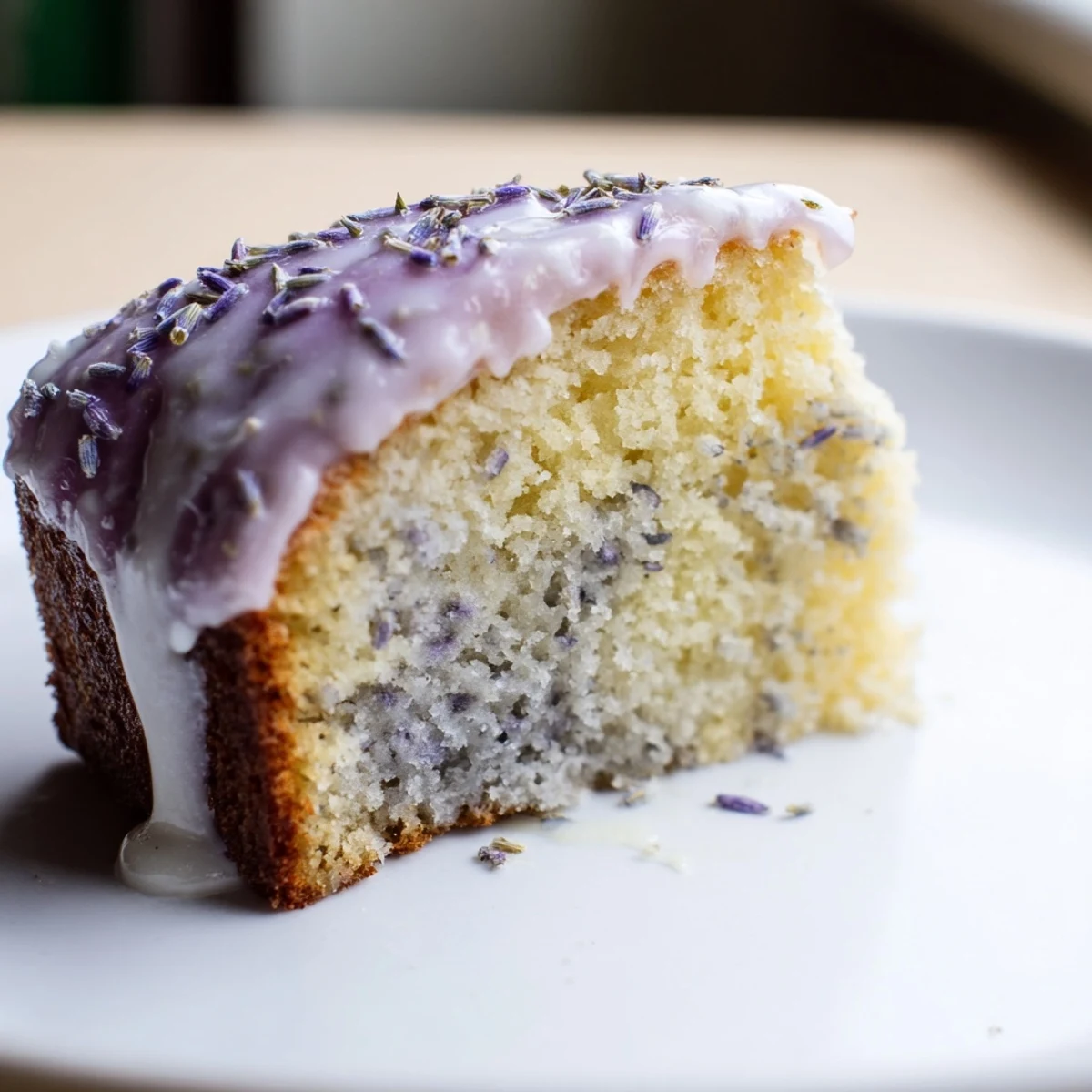 Fragrant lavender cake with lemon glaze drizzled over a tender golden crumb
