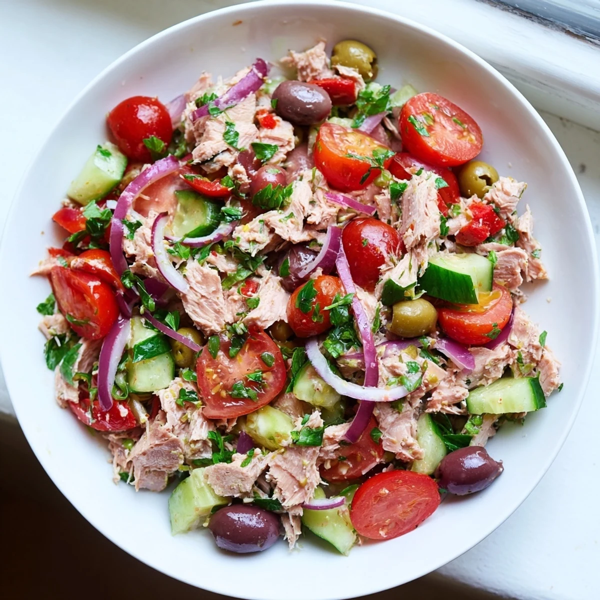 Flaked tuna tossed with crisp cucumbers, roasted red peppers, and tangy lemon dressing