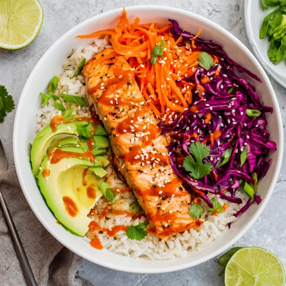 Oven-roasted Bang Bang Salmon Bowls with flaky fish and creamy spicy sauce