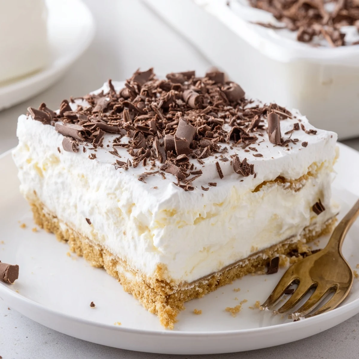 Chilled No Bake Layered Dessert topped with chocolate shavings, ready to serve