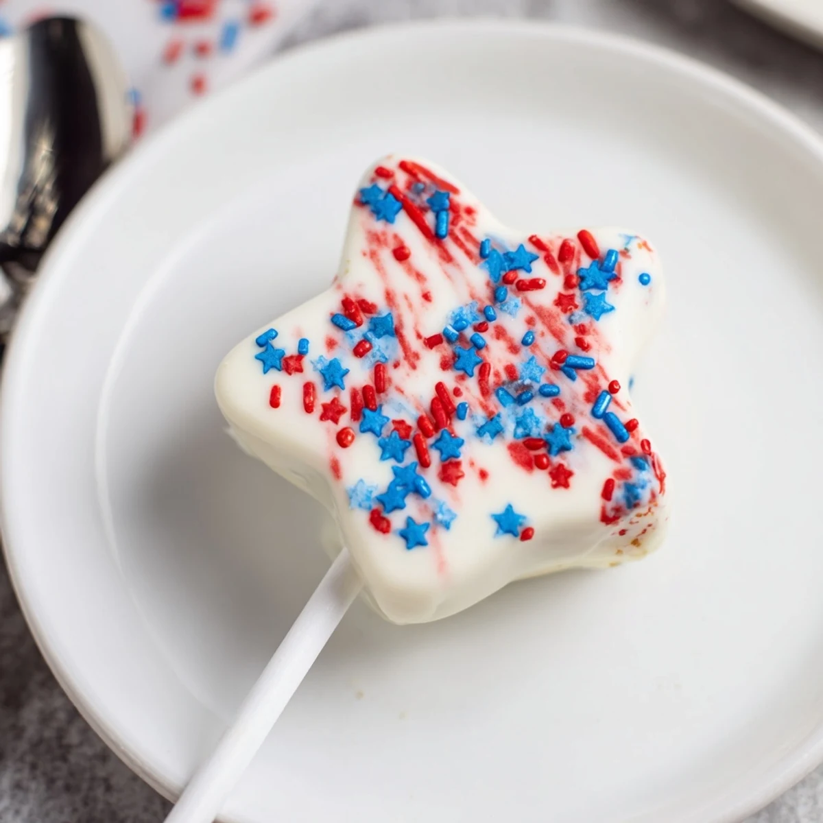 Fourth Of July Star Cheesecake Pops creamy, chocolate-dipped stars with patriotic sprinkles