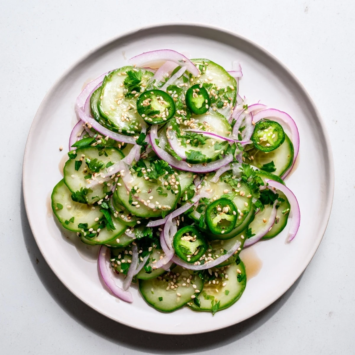 Fresh honey lime cucumber salad with crisp sliced cucumbers in a tangy citrus dressing