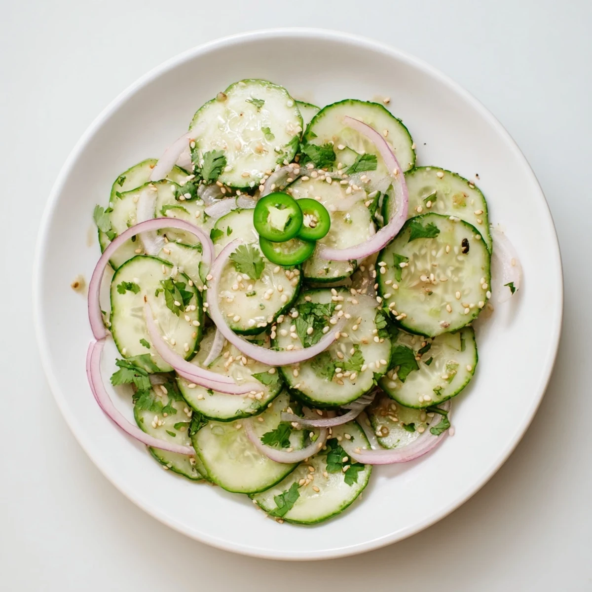 Refreshing honey lime cucumber salad featuring crisp vegetables coated in sweet lime dressing