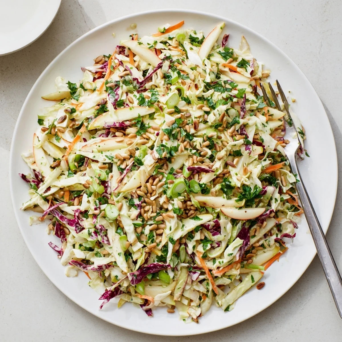 Crisp apple coleslaw featuring crunchy green apples, colorful cabbage, and tangy honey-mustard dressing